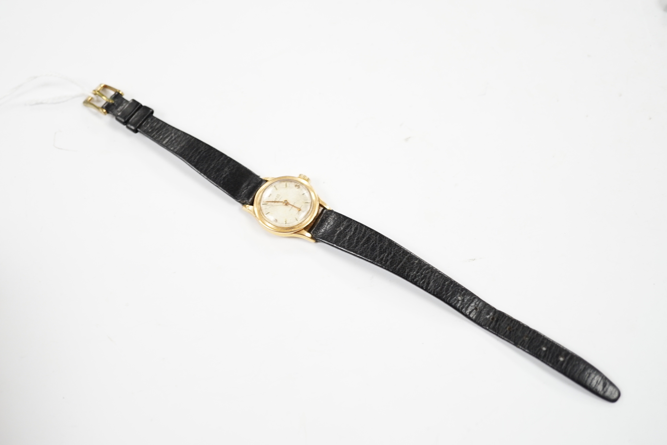 A lady's Swiss Sabina 18k manual wind wrist watch, on a leather strap.